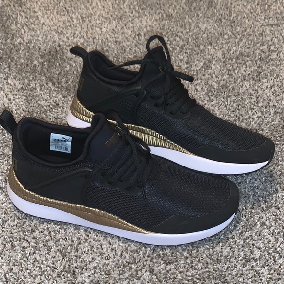 Puma Shoes - Black and Gold Puma tennis shoes
